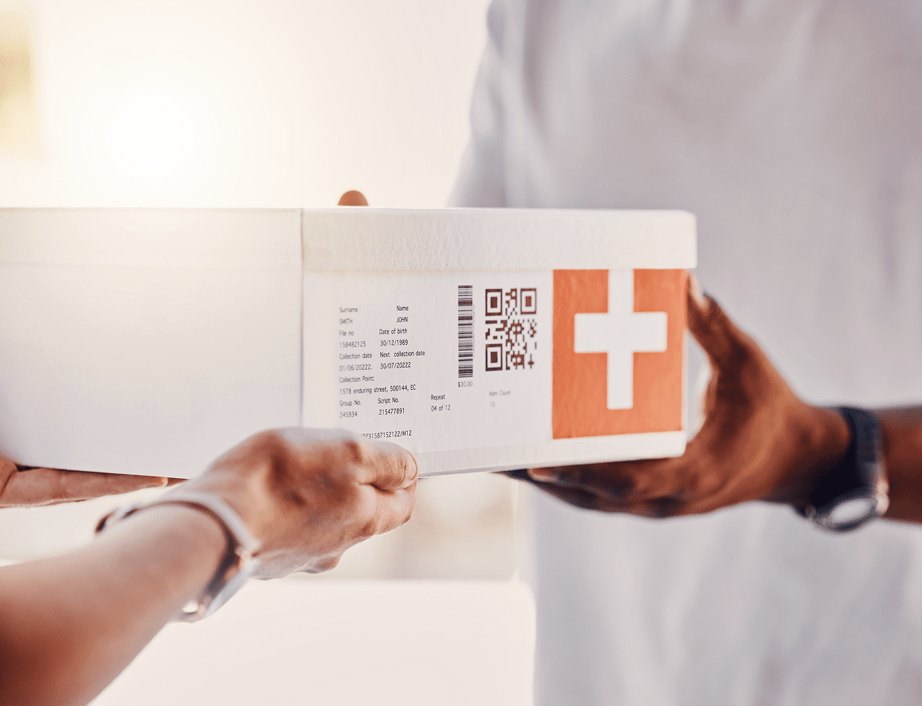 Hands exchanging a labeled package.